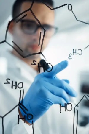 Scientist performing chemistry to examine measurement uncertainty in a laboratory.