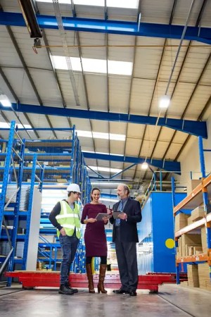certification body at a factory examining processes.