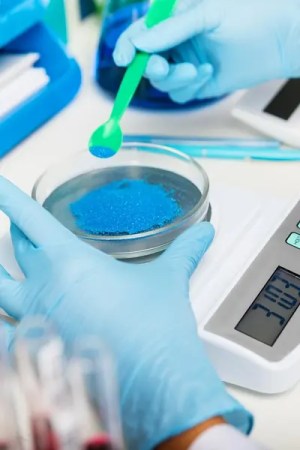 Laboratory researcher calibrating a sample adhering to ISO 17034.