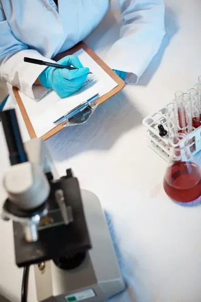 forensic assessor in a laboratory.