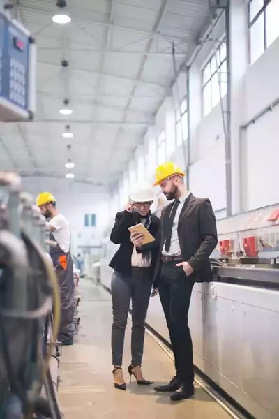 inspectors performing conformity assessment at a factory