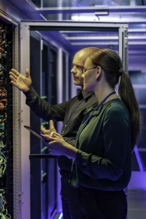 Information security management specialists annalyzing that IT equipment adheres to ISO 27006 requirements.