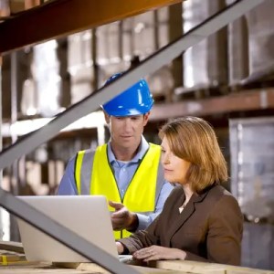 Inspector assessing that warehouse is adhering to ISO/IEC 17020 requirements.